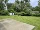 A view of the expansive backyard with a storage shed and lush greenery, offering a serene outdoor space at 4004 N Ball Ave, Muncie, IN 47304