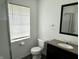 This bathroom has a toilet, mirror, shower, sink with cabinet, and a window at 4004 N Ball Ave, Muncie, IN 47304
