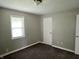 Bedroom with carpet, one window with blinds, neutral paint and a closet at 4004 N Ball Ave, Muncie, IN 47304