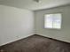 Bedroom with carpet, one window with blinds, neutral paint and standard ceiling light at 4004 N Ball Ave, Muncie, IN 47304