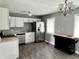 Modern kitchen with stainless steel appliances and white cabinets at 4004 N Ball Ave, Muncie, IN 47304