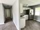 Cozy kitchen features a stainless steel refrigerator and white cabinets at 4004 N Ball Ave, Muncie, IN 47304
