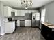 Updated kitchen featuring stainless steel appliances and white cabinets at 4004 N Ball Ave, Muncie, IN 47304