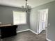 Laundry room with wood flooring and a chandelier at 4004 N Ball Ave, Muncie, IN 47304
