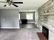 Cozy living room with gray walls, a stone fireplace, and carpet flooring at 4004 N Ball Ave, Muncie, IN 47304