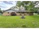 Spacious backyard with green grass and a brick-clad home at 403 Us Highway 31 N, Greenwood, IN 46142