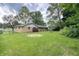 Wide backyard showing the back of the house, a brick ranch at 403 Us Highway 31 N, Greenwood, IN 46142