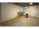 Unfinished basement with cement flooring, block wall, and utility sink at 403 Us Highway 31 N, Greenwood, IN 46142