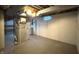 Unfinished basement with exposed ceiling, cement flooring, and utility equipment at 403 Us Highway 31 N, Greenwood, IN 46142