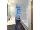 Full bathroom includes a vanity sink, updated fixtures, and a shower-tub combination at 403 Us Highway 31 N, Greenwood, IN 46142
