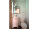 Bathroom features a white vanity with sink, standard toilet, and mirror with lighting at 403 Us Highway 31 N, Greenwood, IN 46142