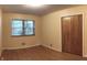 Bedroom has hardwood floors, natural light from the window, and a closet for storage at 403 Us Highway 31 N, Greenwood, IN 46142
