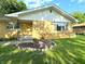 A close view of a brick single-Gathering home showing the entry and landscaping details at 403 Us Highway 31 N, Greenwood, IN 46142