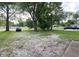 A charming view of the home's expansive front yard with healthy mature trees and ample space for recreation and landscaping at 403 Us Highway 31 N, Greenwood, IN 46142