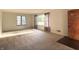 Bright living room with fresh carpeting, large windows with great light, and unique front door at 403 Us Highway 31 N, Greenwood, IN 46142