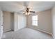 Neutral bedroom with a ceiling fan, a closet with folding doors and carpet flooring at 4056 Orchard Valley Ln, Indianapolis, IN 46235