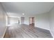 Spacious living room featuring modern flooring, neutral paint, and ample natural light at 4056 Orchard Valley Ln, Indianapolis, IN 46235