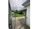 A view of the backyard, featuring a covered patio and lush green lawn at 4113 W 30Th St, Indianapolis, IN 46222