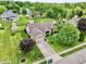 Charming home with a spacious yard, mature trees, and an attached two-car garage at 412 Sonhatsett Dr, Westfield, IN 46074