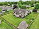 Aerial view of the property, showcasing the home, deck, storage shed, and beautifully landscaped yard at 412 Sonhatsett Dr, Westfield, IN 46074