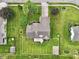 Aerial view of the property, highlighting the home's layout, landscaping, deck, shed, and overall curb appeal at 412 Sonhatsett Dr, Westfield, IN 46074