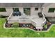 Aerial view of a home's back deck featuring a grill, outdoor seating, and well-maintained landscaping at 412 Sonhatsett Dr, Westfield, IN 46074