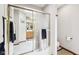 Shower room with clear glass doors showing a wooden cabinet and large mirrors at 412 Sonhatsett Dr, Westfield, IN 46074