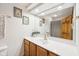 Bathroom features a vanity with white countertop and a large framed mirror at 412 Sonhatsett Dr, Westfield, IN 46074