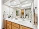 Spacious bathroom featuring a double sink vanity, a large mirror, and recessed lighting at 412 Sonhatsett Dr, Westfield, IN 46074