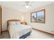 Cozy bedroom with a ceiling fan and a window view of the house exterior at 412 Sonhatsett Dr, Westfield, IN 46074