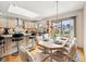Eat-in kitchen with stainless steel appliances, granite countertops, and a sliding glass door to the backyard at 412 Sonhatsett Dr, Westfield, IN 46074