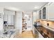 Modern kitchen with stainless steel appliances, granite countertops, custom cabinets and pantry shelves at 412 Sonhatsett Dr, Westfield, IN 46074
