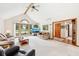 Open concept living area featuring a vaulted ceiling, large windows, and hardwood entryway at 412 Sonhatsett Dr, Westfield, IN 46074