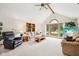 Bright living room with vaulted ceiling, large windows, and comfortable seating at 412 Sonhatsett Dr, Westfield, IN 46074