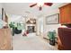 Bright living room with a fireplace, large windows, and open access to the rest of the home at 412 Sonhatsett Dr, Westfield, IN 46074