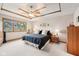Spacious main bedroom featuring a decorative ceiling, a fan, and a window at 412 Sonhatsett Dr, Westfield, IN 46074