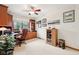 Cozy office space with wood built-ins, desk area, and natural light from the window at 412 Sonhatsett Dr, Westfield, IN 46074