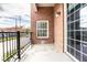 Brick balcony with metal railing offers a view of the surrounding street at 435 Virginia Ave # 106, Indianapolis, IN 46203