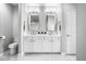 Modern bathroom with double vanity, marble countertops, and updated fixtures at 435 Virginia Ave # 106, Indianapolis, IN 46203