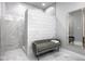 Luxurious bathroom with a tiled walk-in shower and bench seating at 435 Virginia Ave # 106, Indianapolis, IN 46203