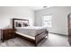 Well-lit bedroom boasts a large window, plush bed, and stylish furniture at 435 Virginia Ave # 106, Indianapolis, IN 46203