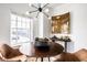 Bright dining area features a modern light fixture, round table, and stylish decor at 435 Virginia Ave # 106, Indianapolis, IN 46203
