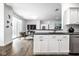 Bright modern kitchen open to the living room with stainless steel appliances at 435 Virginia Ave # 106, Indianapolis, IN 46203