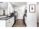 Bright kitchen with stainless steel appliances, modern finishes, and ample counter space at 435 Virginia Ave # 106, Indianapolis, IN 46203