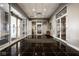 An elegant lobby with a black marble floor, multiple glass doors, and modern interior finishes at 435 Virginia Ave # 106, Indianapolis, IN 46203