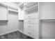 Bright walk-in closet features shelving, drawers, and ample storage space at 435 Virginia Ave # 106, Indianapolis, IN 46203