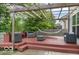Inviting backyard deck with a pergola, hammock, and stylish outdoor seating at 4689 Muscatine Way, Westfield, IN 46062