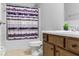 Clean bathroom featuring a shower with purple striped curtains at 4689 Muscatine Way, Westfield, IN 46062