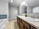 Spacious bathroom with double vanity, a large mirror, and blue tiled backsplash at 4689 Muscatine Way, Westfield, IN 46062