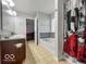 Well-lit bathroom with a double vanity, tub, and modern fixtures, providing a functional and stylish space at 4689 Muscatine Way, Westfield, IN 46062
